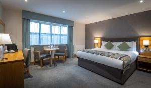 Krevet ili kreveti u jedinici u okviru objekta Westgrove Hotel
