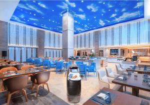 En restaurant eller et spisested på FlyZoo Hotel - Alibaba Future Hotel