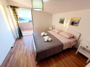 Postel nebo postele na pokoji v ubytování Apartman Šime