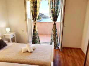 Postel nebo postele na pokoji v ubytování Apartman Šime