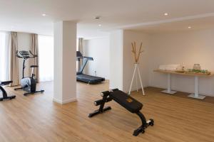a gym with several exercise bikes in a room at HSM Linda Playa in Paguera