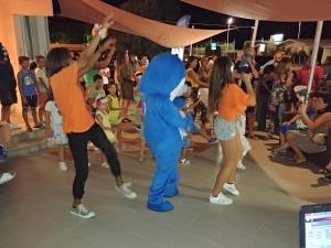 a group of people dancing in front of a crowd at Hotel Miramare in Marotta