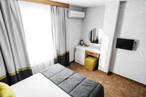 TV a/nebo společenská místnost v ubytování Carlton Hotel Old City