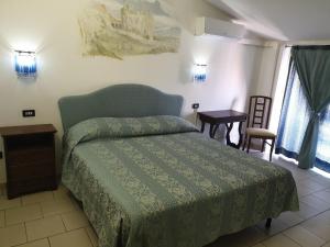 Hotel Ristorante Bagnaia tesisinde bir odada yatak veya yataklar