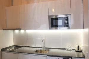 Kuchyňa alebo kuchynka v ubytovaní Balaustrada Apartments