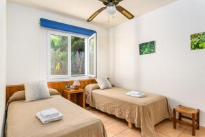 Posteľ alebo postele v izbe v ubytovaní Villa BiniLlor by Mauter Villas + 37 fotografií