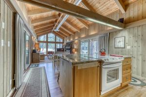 a kitchen with wooden walls and wooden floors at Bracken Lane Golf Retreat (GH 86) in Black Butte Ranch