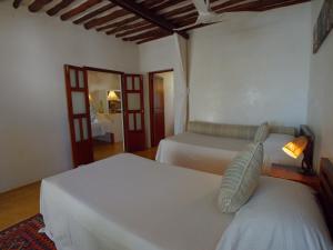 Postel nebo postele na pokoji v ubytování Peponi Hotel Lamu - Kenya