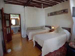 Postel nebo postele na pokoji v ubytování Peponi Hotel Lamu - Kenya