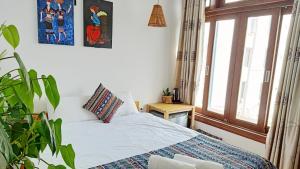 Postel nebo postele na pokoji v ubytování Hotel Làng Kò Hơ