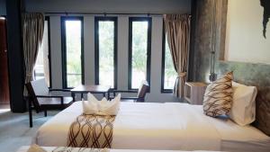 Katil atau katil-katil dalam bilik di Midtown Sukhothai