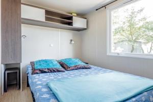 เตียงในห้องที่ Camping Taxo Les Pins - Maeva +31 ภาพ