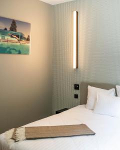 Cama o camas de una habitación en Hostellerie du Grünewald