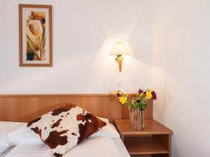 Ένα ή περισσότερα κρεβάτια σε δωμάτιο στο Hotel Oberland