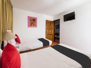 Postel nebo postele na pokoji v ubytování Suites Internacional