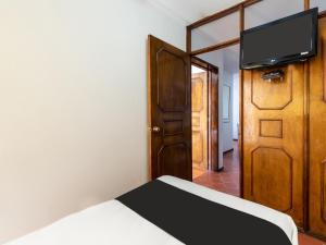 TV a/nebo společenská místnost v ubytování Suites Internacional