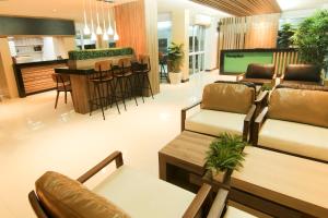 a living room with a couch and a table at Smith Residence in Suratthani