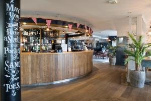 a bar with a wooden counter in a restaurant at Seacroft in Holyhead