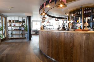 a bar with a wooden counter in a room at Seacroft in Holyhead