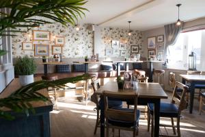 a dining room with a table and chairs at Seacroft in Holyhead