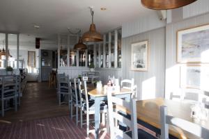 a dining room with a table and chairs at Seacroft in Holyhead