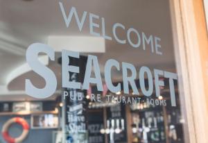 a store window with the words welcome to sergopt at Seacroft in Holyhead