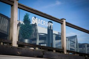a sign in the window of a building at Seacroft in Holyhead