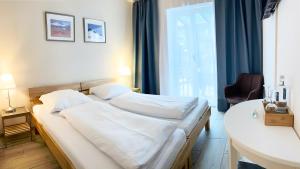Postel nebo postele na pokoji v ubytování Arena Stadt München