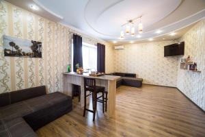 a living room with a table and a couch at HOLLYWOOD in Poltava