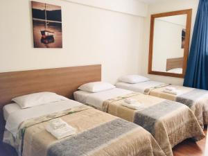 Cama ou camas em um quarto em Hotel Paris Lima