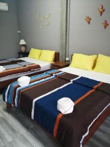 Postel nebo postele na pokoji v ubytování Yotin Guest House