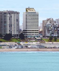 a view of a city with tall buildings and a beach at Hotel Costa Galana in Mar del Plata