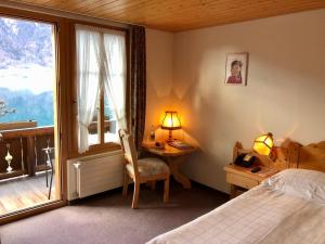 Postel nebo postele na pokoji v ubytování Hotel Châlet Du Lac + 37 fotografií