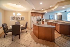 a large kitchen with a table and a dining room at Links at Thousand Hills in Branson