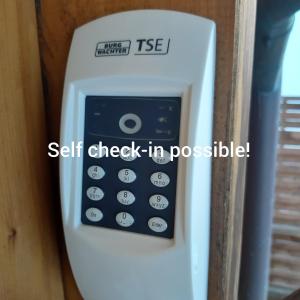 a safe check in a room with the words self check in possible at Chalet Ferreira in Weite