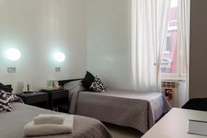 Postel nebo postele na pokoji v ubytování Hotel Sol Levante