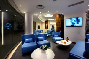 TV a/nebo společenská místnost v ubytování Callistos Hotel & Spa