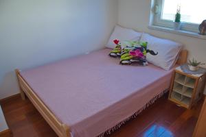 Postel nebo postele na pokoji v ubytování Apartment Olive Garden