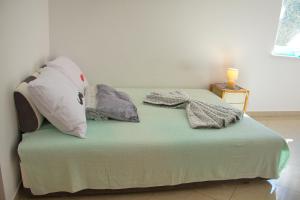 Postel nebo postele na pokoji v ubytování Apartment Olive Garden