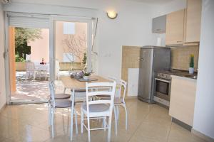Kuchyň nebo kuchyňský kout v ubytování Apartment Olive Garden