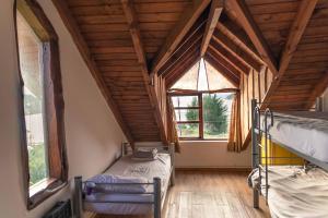 Ένα ή περισσότερα κρεβάτια σε δωμάτιο στο Bonita Lake House - Hostel & Bungalows