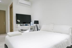 Katil atau katil-katil dalam bilik di ReCharge Cozy Room Suite