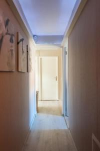an empty hallway with a white door in a room at CasaLuca in Hellevoetsluis