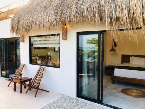 Postel nebo postele na pokoji v ubytování Hotel CasaBakal - A pie de Laguna - Bacalar