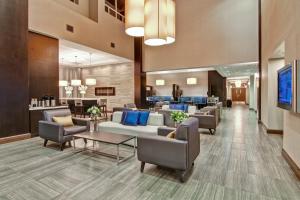 a lobby of a hospital with couches and chairs at The Park Hotel London in London