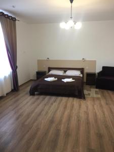 Postel nebo postele na pokoji v ubytování Hotel Karpaty