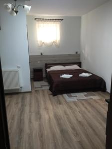 Postel nebo postele na pokoji v ubytování Hotel Karpaty