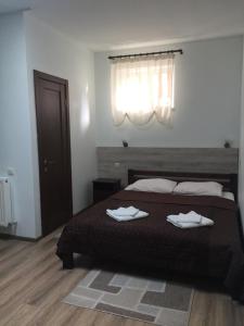 Postel nebo postele na pokoji v ubytování Hotel Karpaty