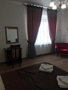 Postel nebo postele na pokoji v ubytování Hotel Karpaty