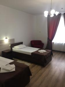 Postel nebo postele na pokoji v ubytování Hotel Karpaty